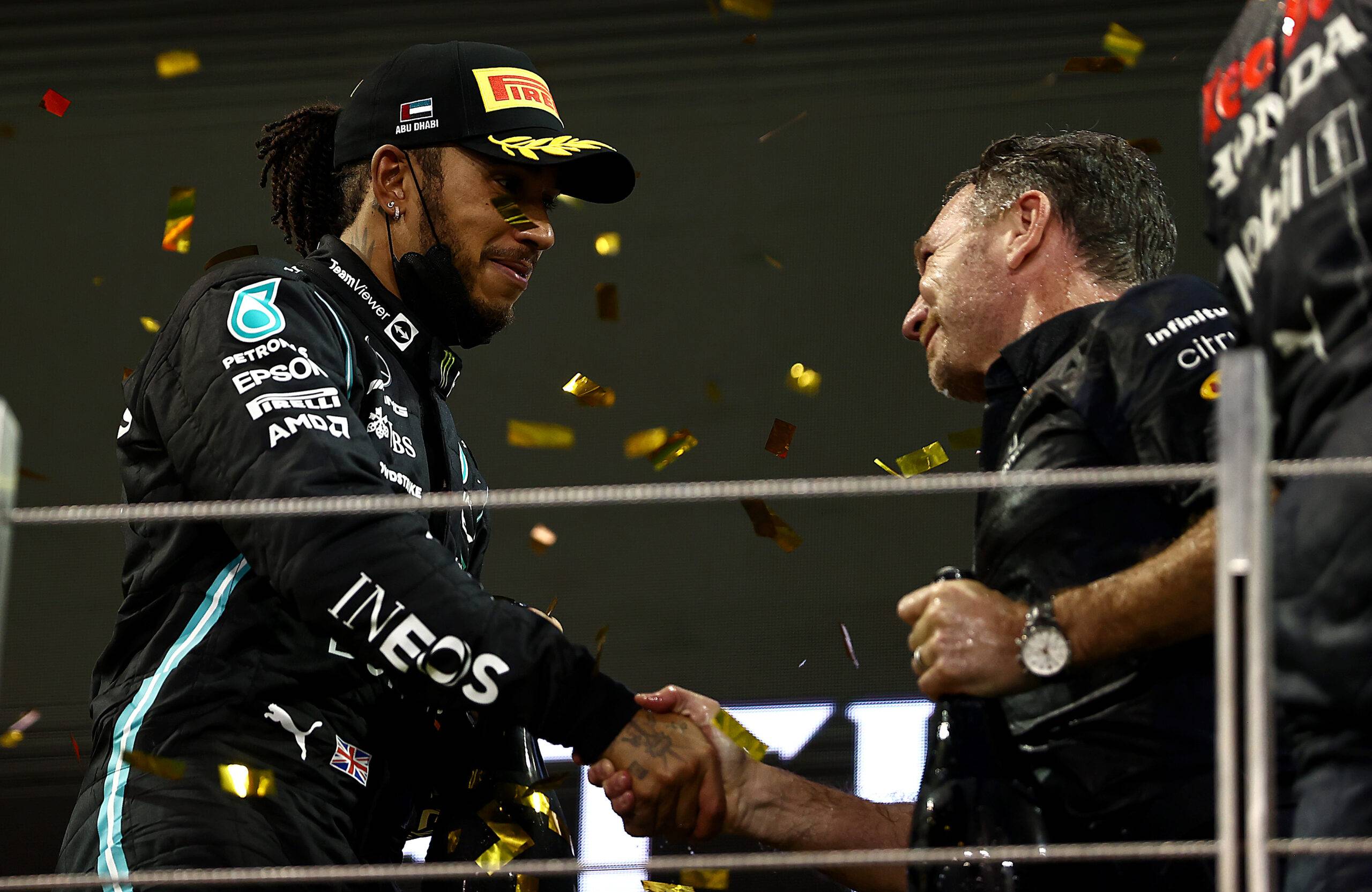 Lewis Hamilton shakes hands with Christian Horner