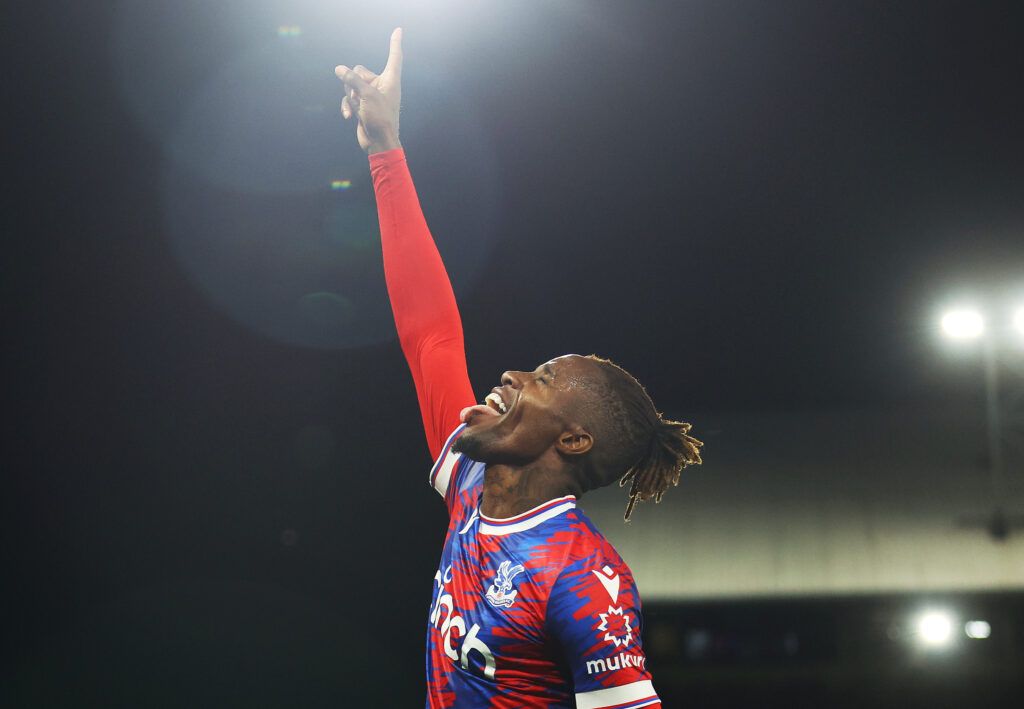Wilfried Zaha of Crystal Palace celebrates after scoring their team's first goal during the Premier League match between Crystal Palace and Brentford FC at Selhurst Park on August 30, 2022 in London, England.