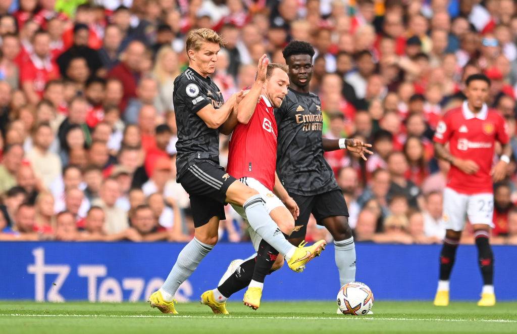 Martin Odegaard and Bukayo Saka tussle for the ball in |Man Utd vs Arsenal