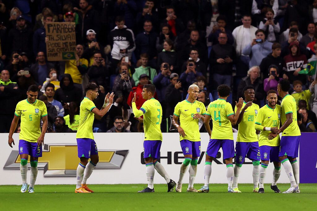 Brazil players celebrate a goal vs Ghana