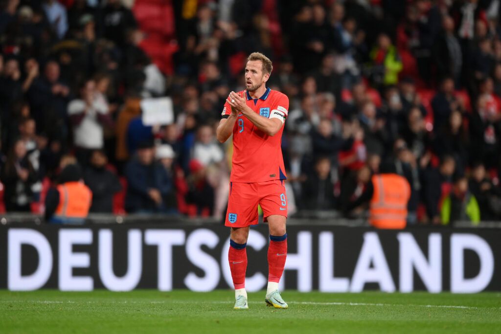 Harry Kane of England applauds the fans
