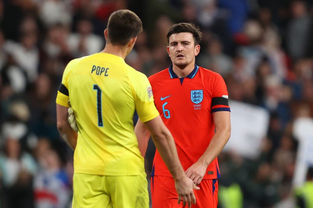 Nick Pope and Harry Maguire look on