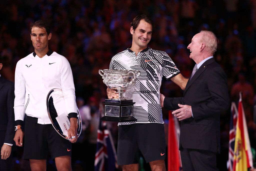  Rafael Nadal of Spain and Rod Laver look on as Roger Federer of Switzerland poses with the Norman Brookes Challenge Cup 