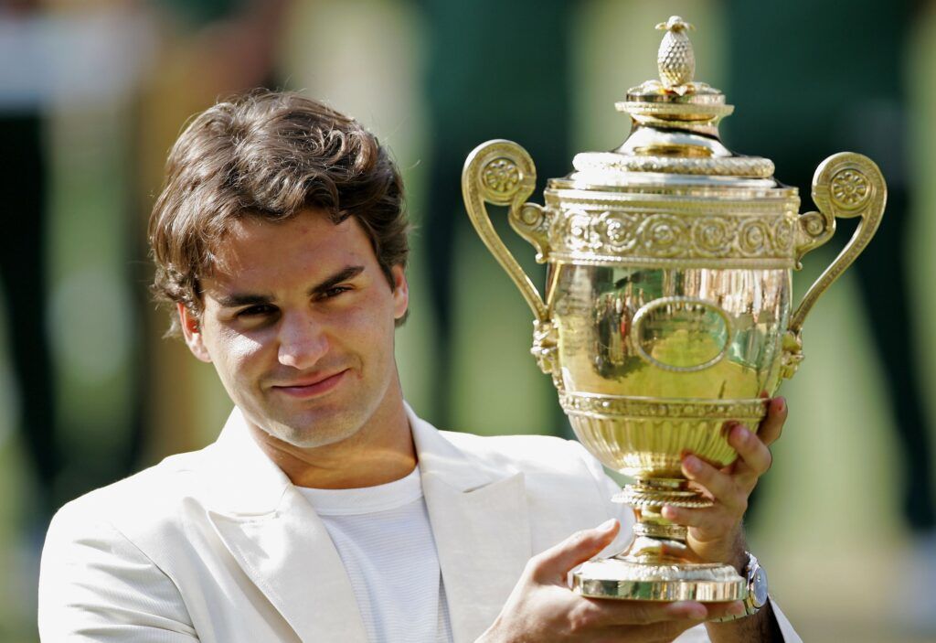 Roger Federer of Switzerland holds the trophy after winning the Men's final 