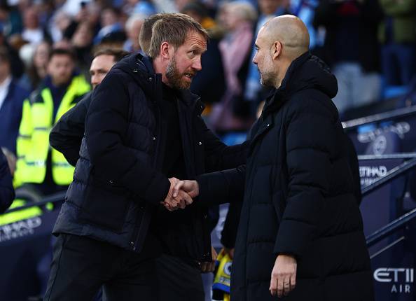 Potter and Guardiola shake hands.