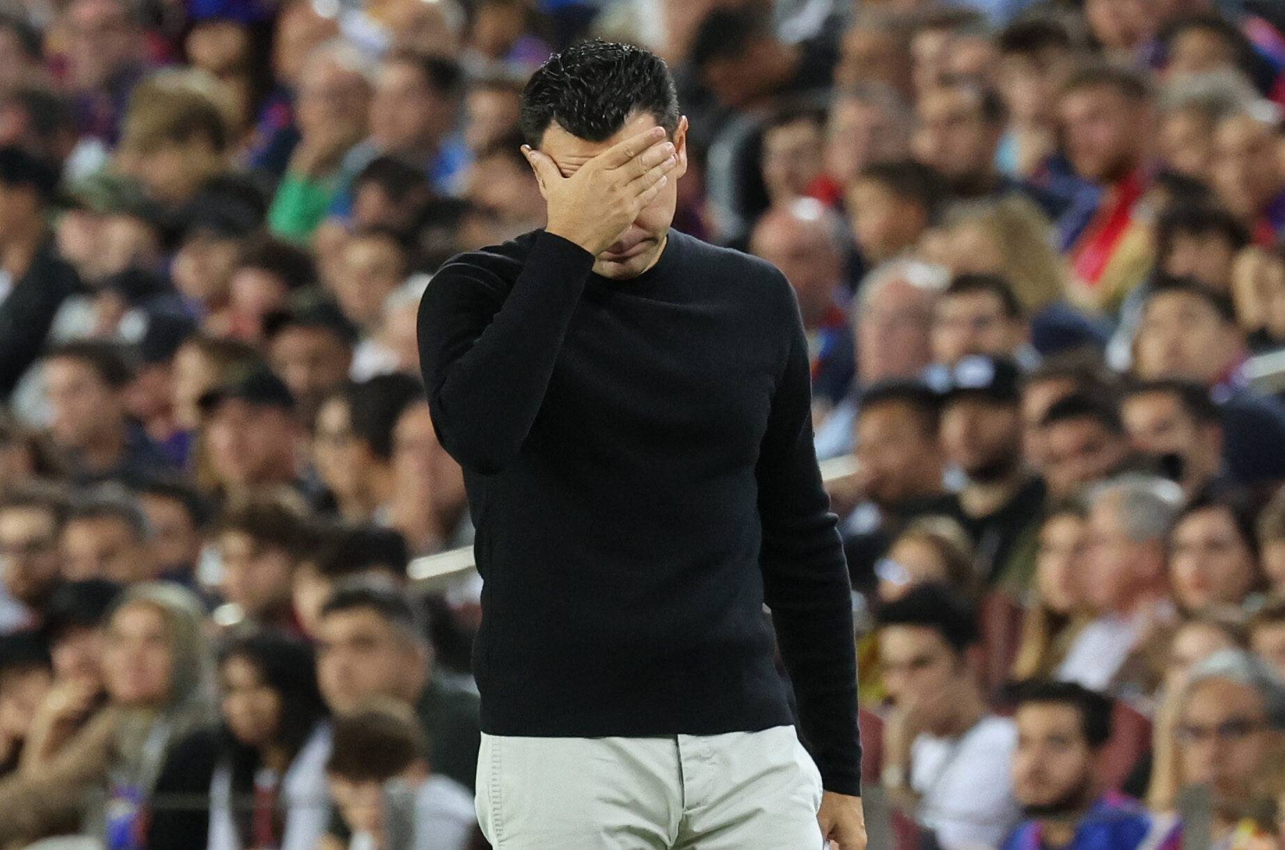 Barcelona's Xavi looks gutted.