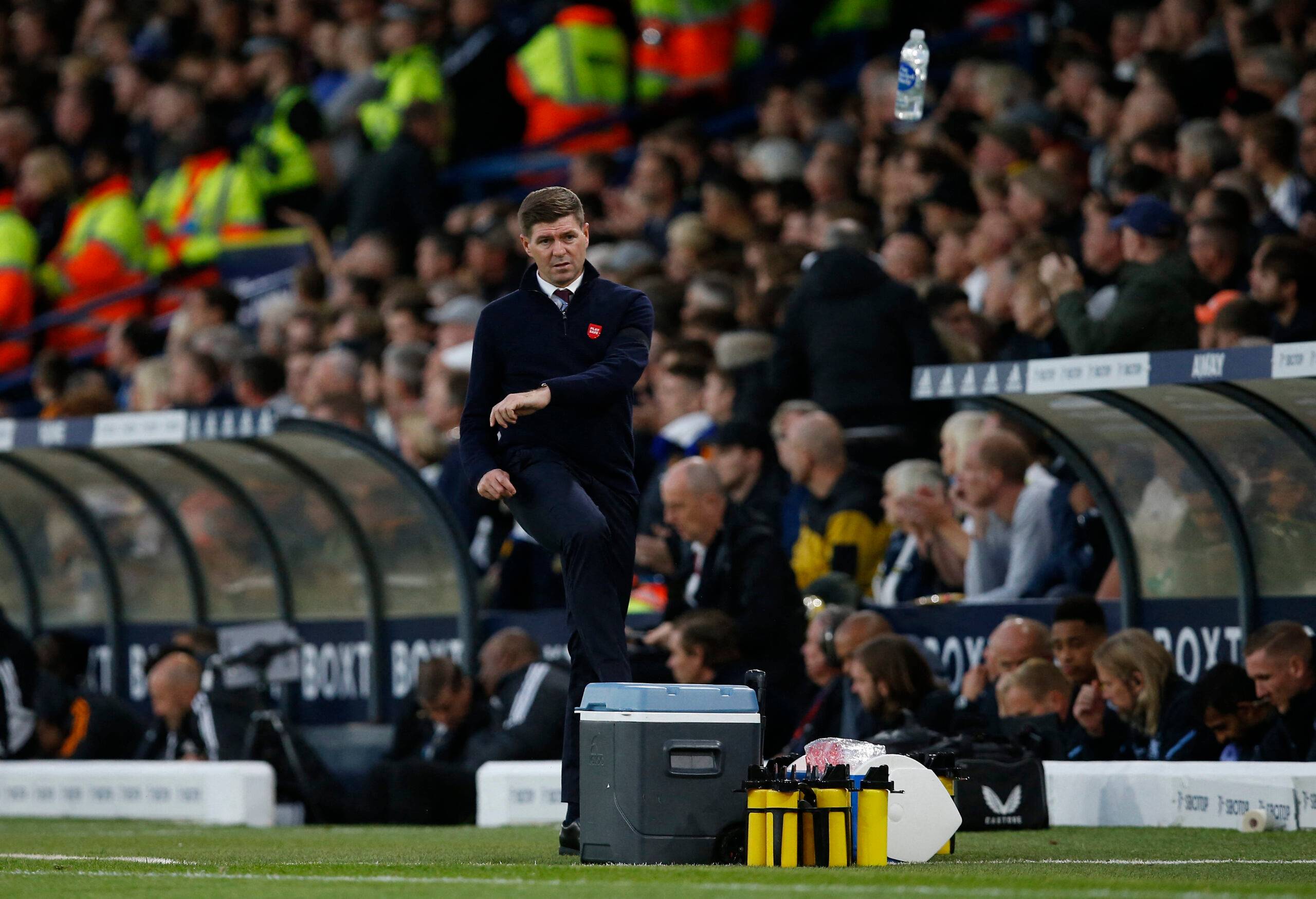 Aston Villa manager Steven Gerrard kicks a water bottle in frustration