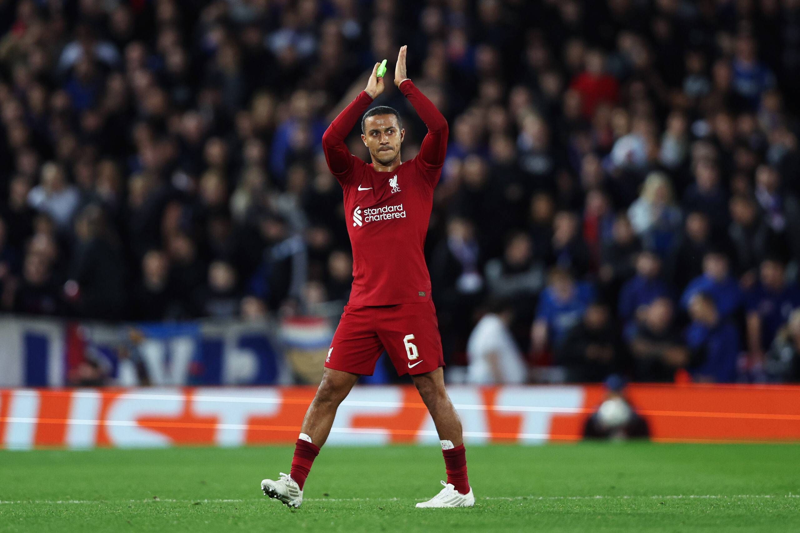 Thiago applauds the fans at Anfield
