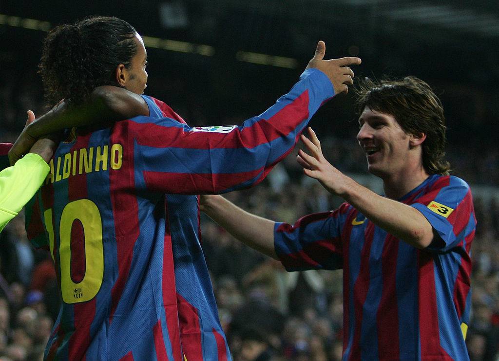 Lionel Messi and Ronaldinho in action for Barcelona
