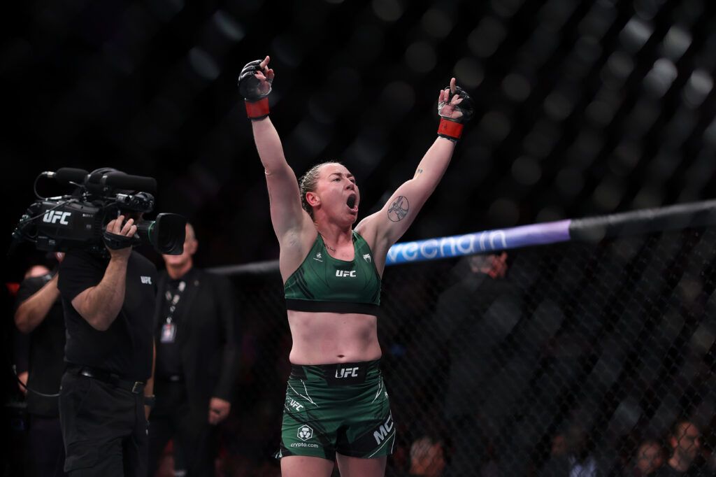 Molly McCann celebrating in the UFC octagon