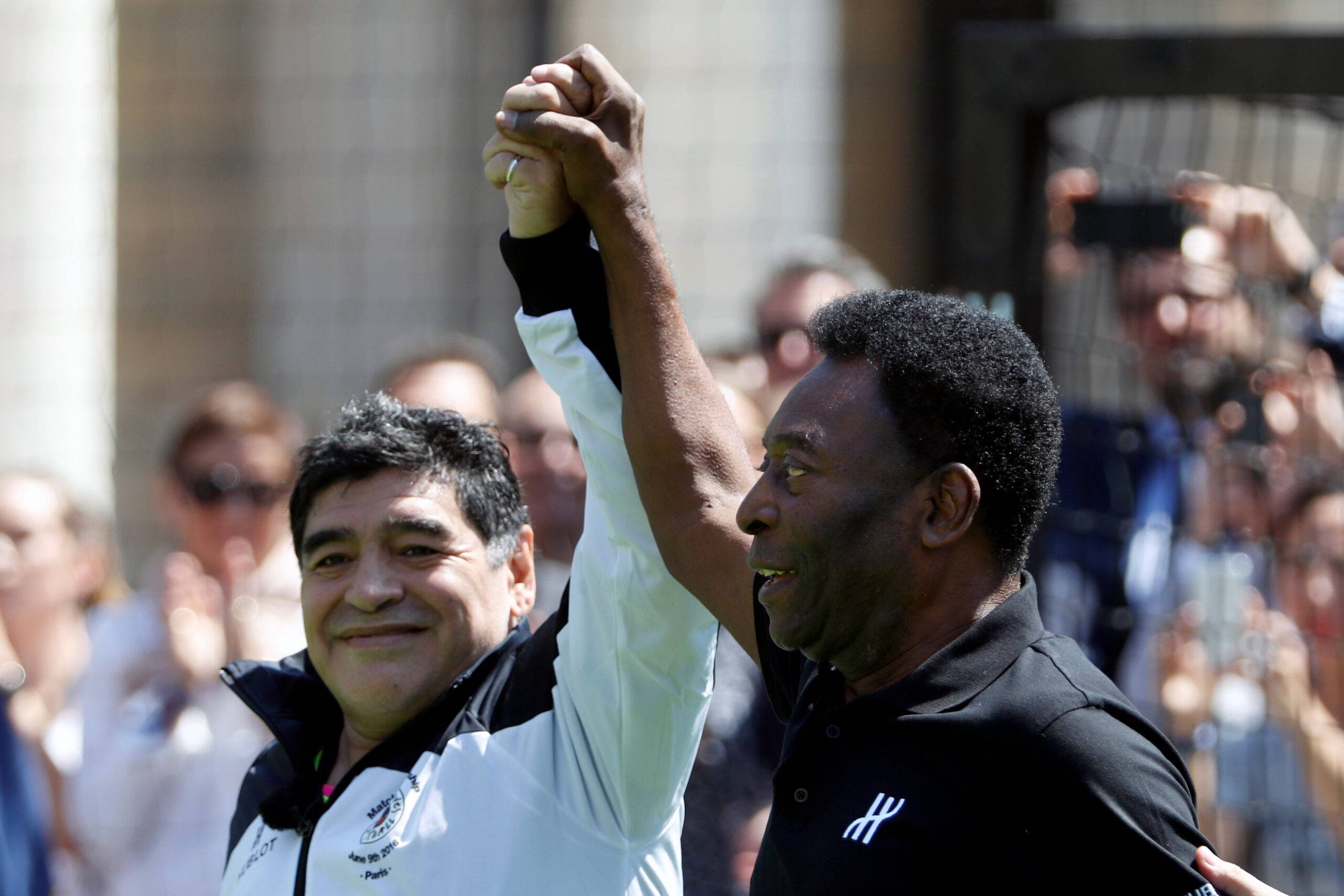 Diego Maradona and Pele share an embrace