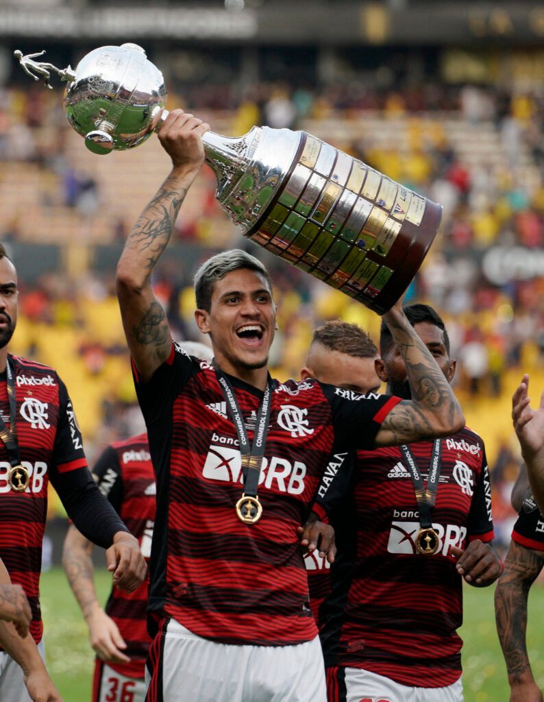 Flamengo's Pedro lifts the Copa Libertadores trophy.