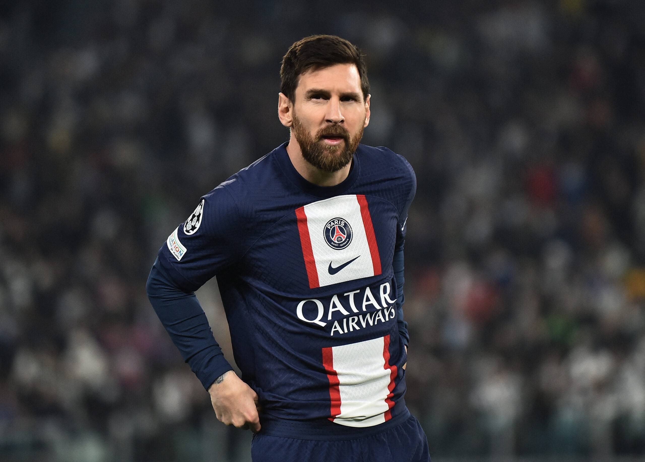 Lionel Messi looks on