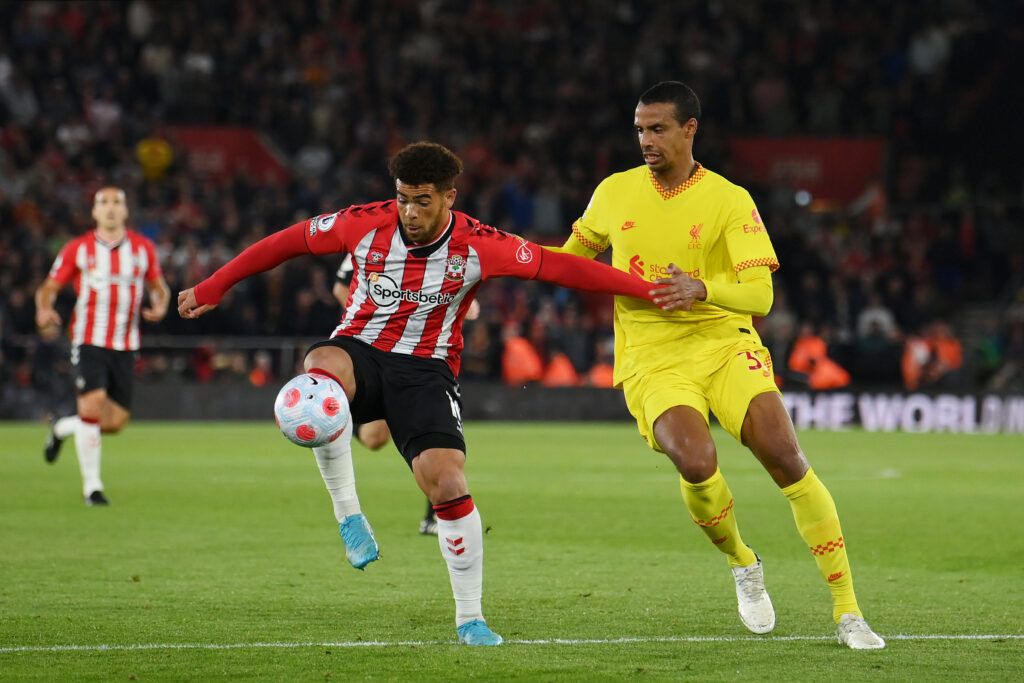 Che Adams of Southampton is challenged by Joel Matip of Liverpool