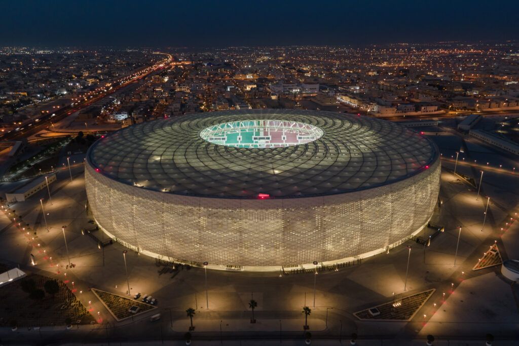 An aerial view of Al Thumama stadium at sunset