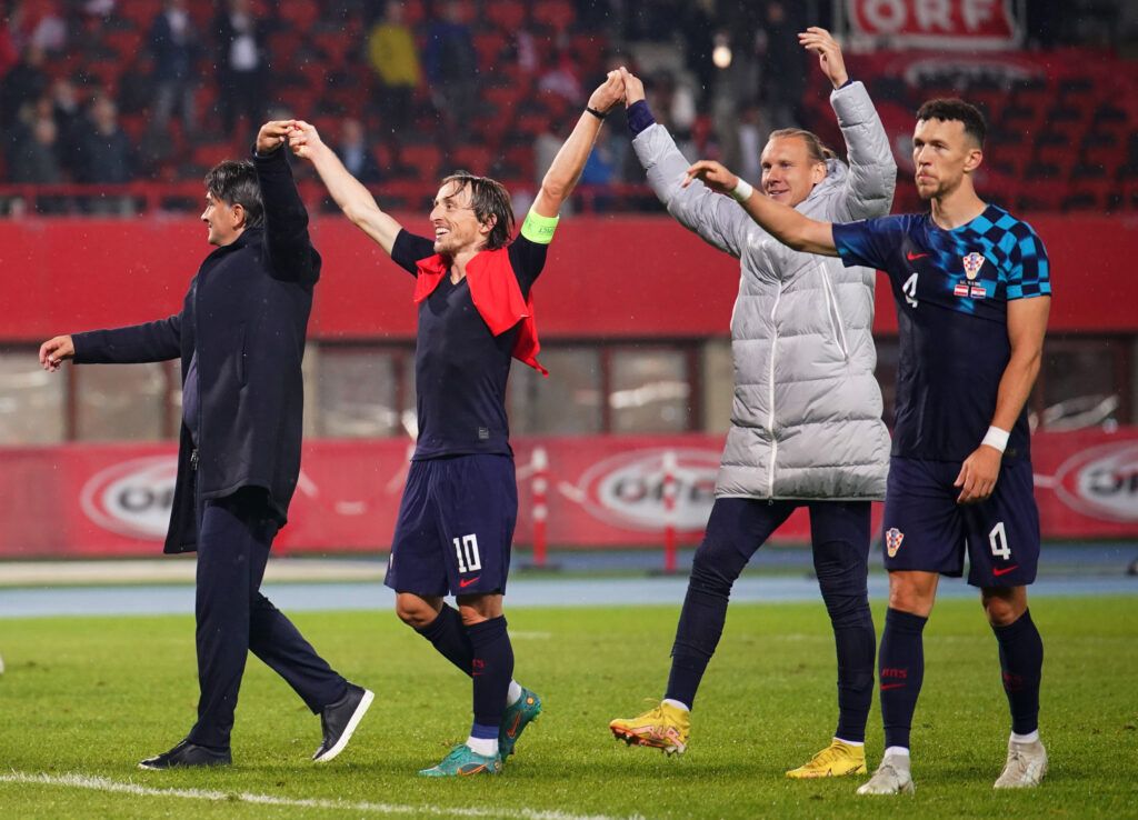 Zlatko Dalic, Head Coach of Croatia, Luka Modric, Domagoj Vida and Ivan Perisic of Croatia celebrate towards the fans following their side's victory in the UEFA Nations League League A Group 1 match between Austria and Croatia at Ernst Happel Stadion on September 25, 2022 in Vienna, Austria.