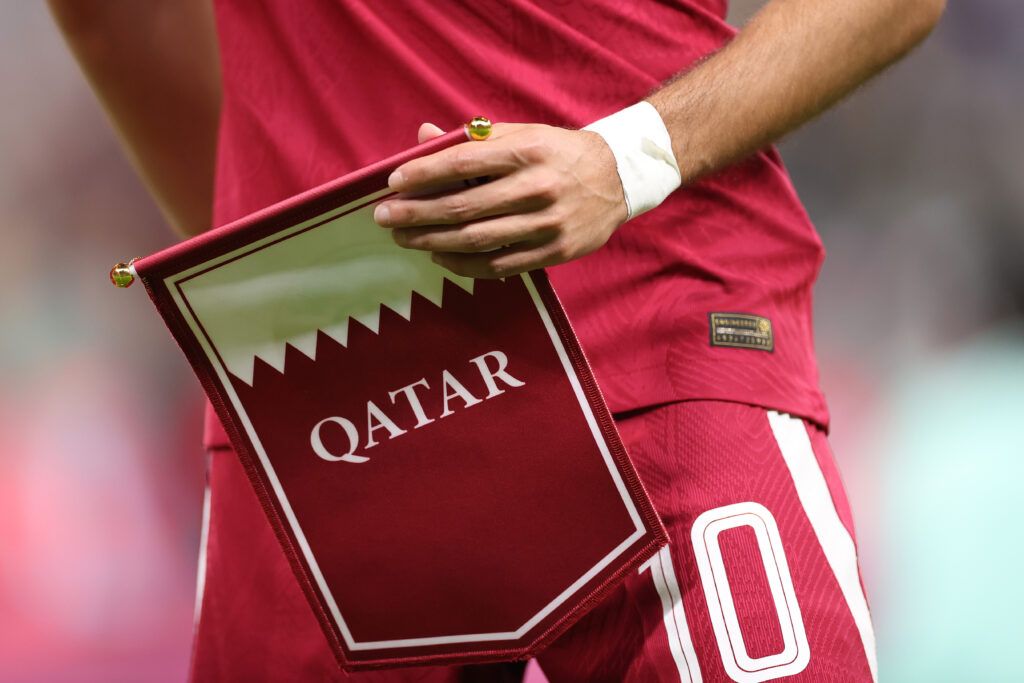 Qatar captain Hassan Alhaydos holds the team pennant before the FIFA World Cup Qatar 2022 Group A match between Qatar and Ecuador at Al Bayt Stadium on November 20, 2022 in Al Khor, Qatar.