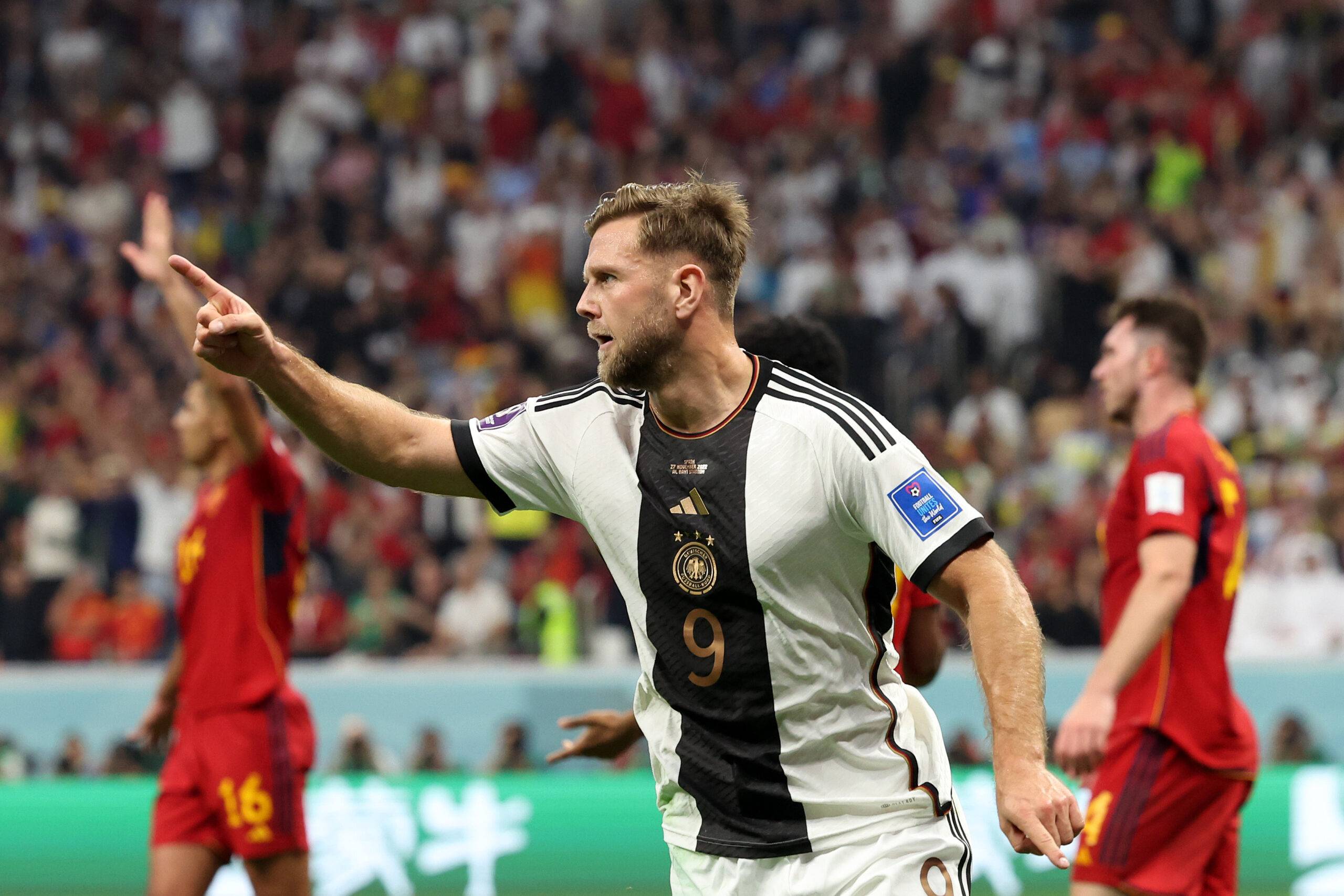 Füllkrug celebrates scoring vs Spain.