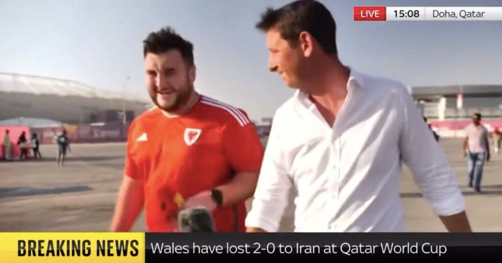 Sky News reporter with Wales fans