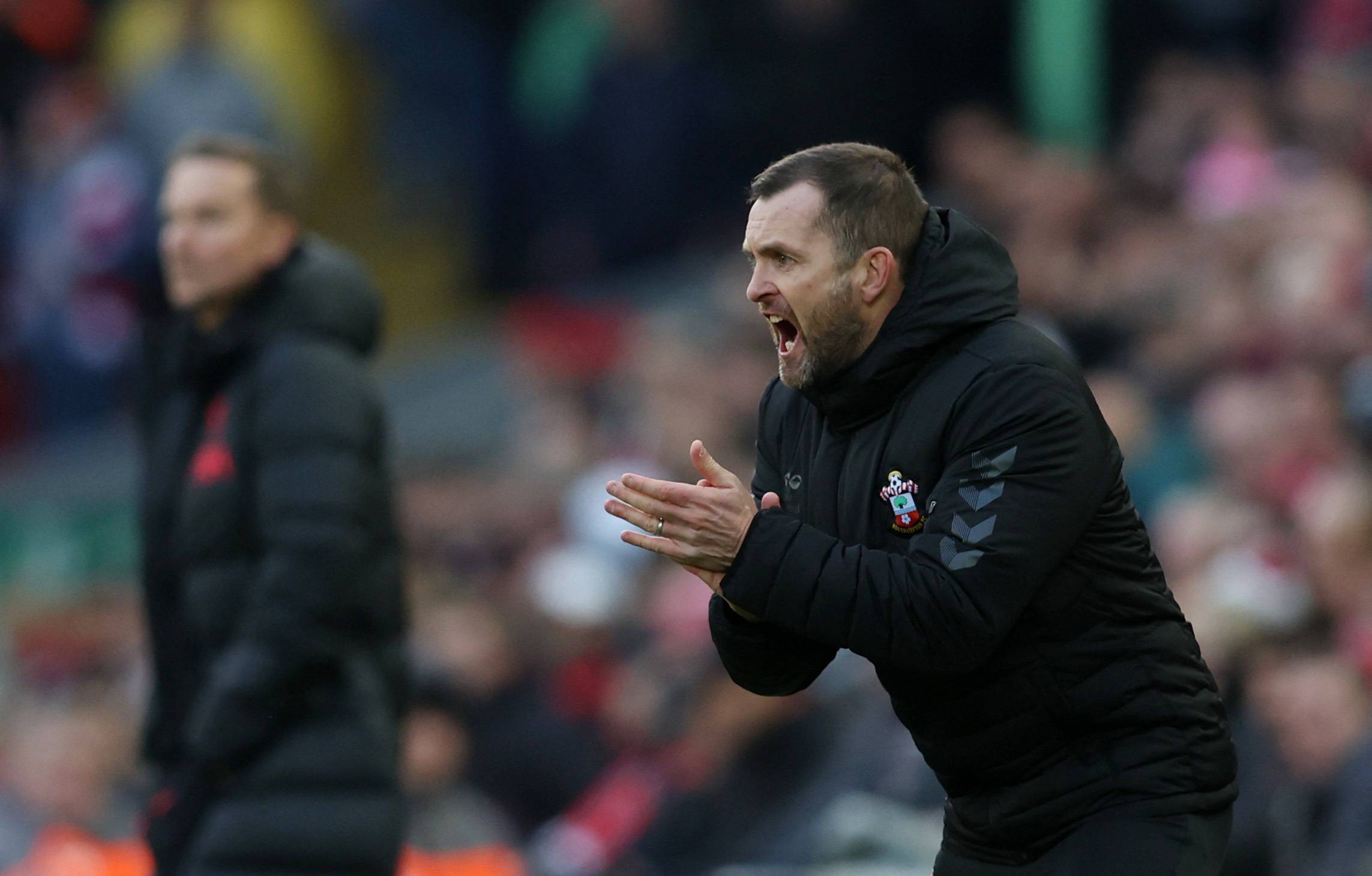 Southampton manager Nathan Jones encouraging his team against Liverpool