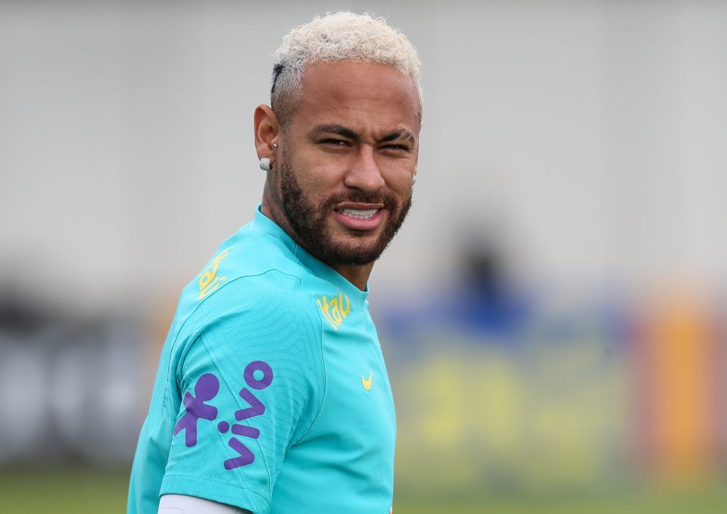 Neymar looks on during training