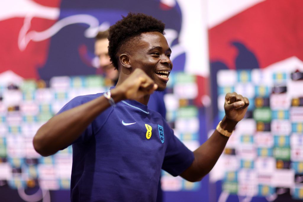 Bukayo Saka of England reacts after the darts match during the England press conference the day after the round of 16 match against Senegal at Al Wakrah Stadium on December 05, 2022 in Doha, Qatar