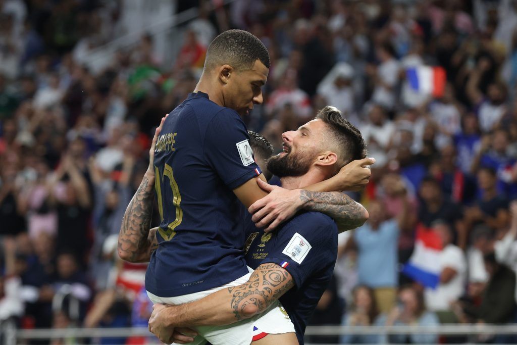 Olivier Giroud of France celebrates with teammate Kylian Mbappe after scoring the team's first goal during the round of 16 match of FIFA World Cup Qatar 2022 between France and Poland at Al Thumama Stadium on December 04, 2022 in Doha, Qatar.